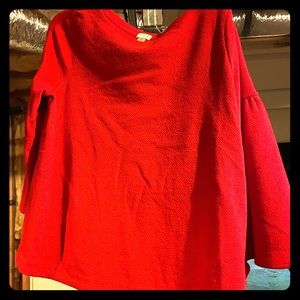 Red top with cute sleeves.